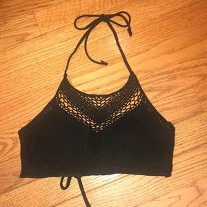 Woman’s black crochet bikini top